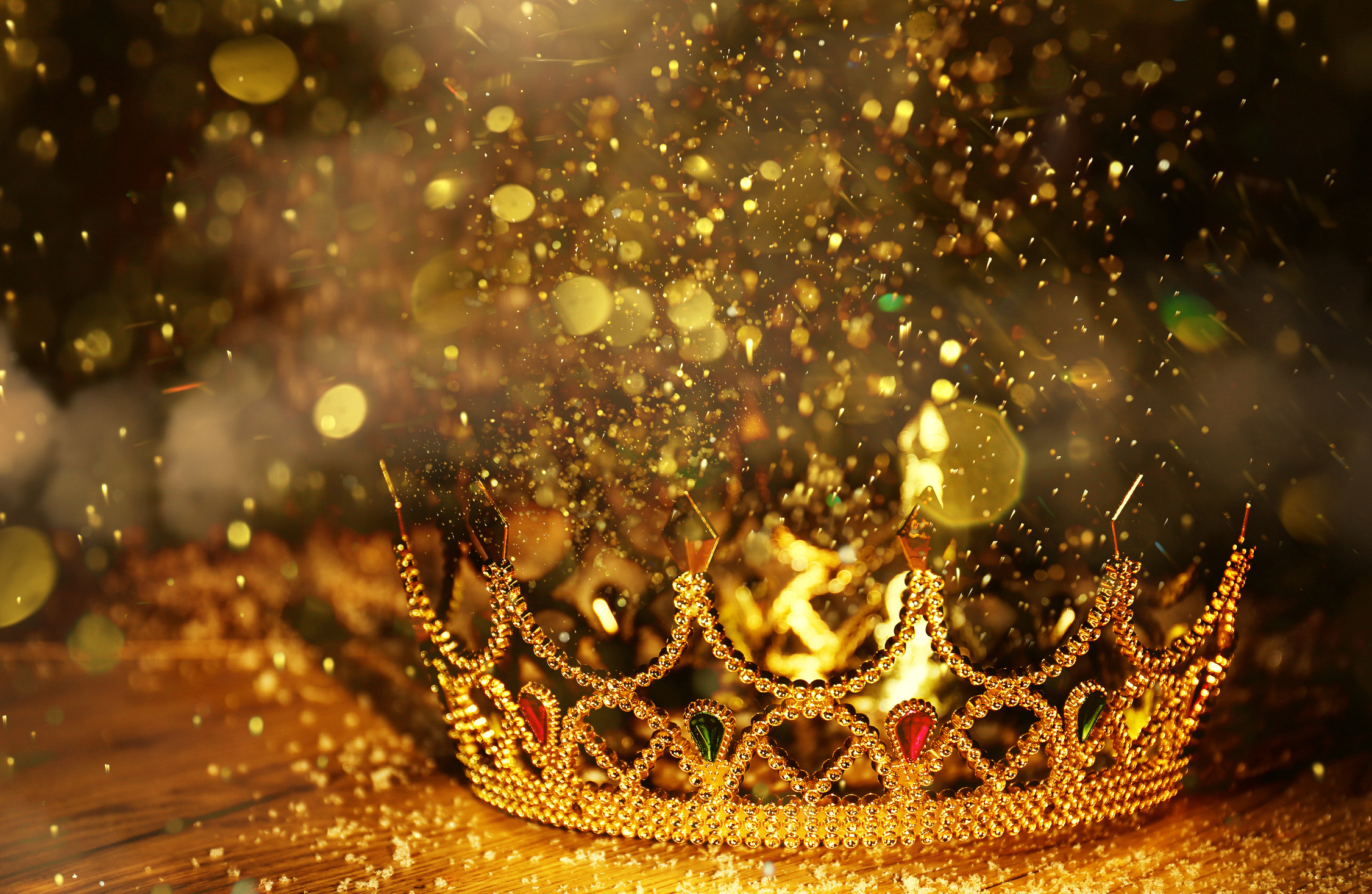 Fantasy World. Beautiful Golden Crown on Table, Bokeh Effect